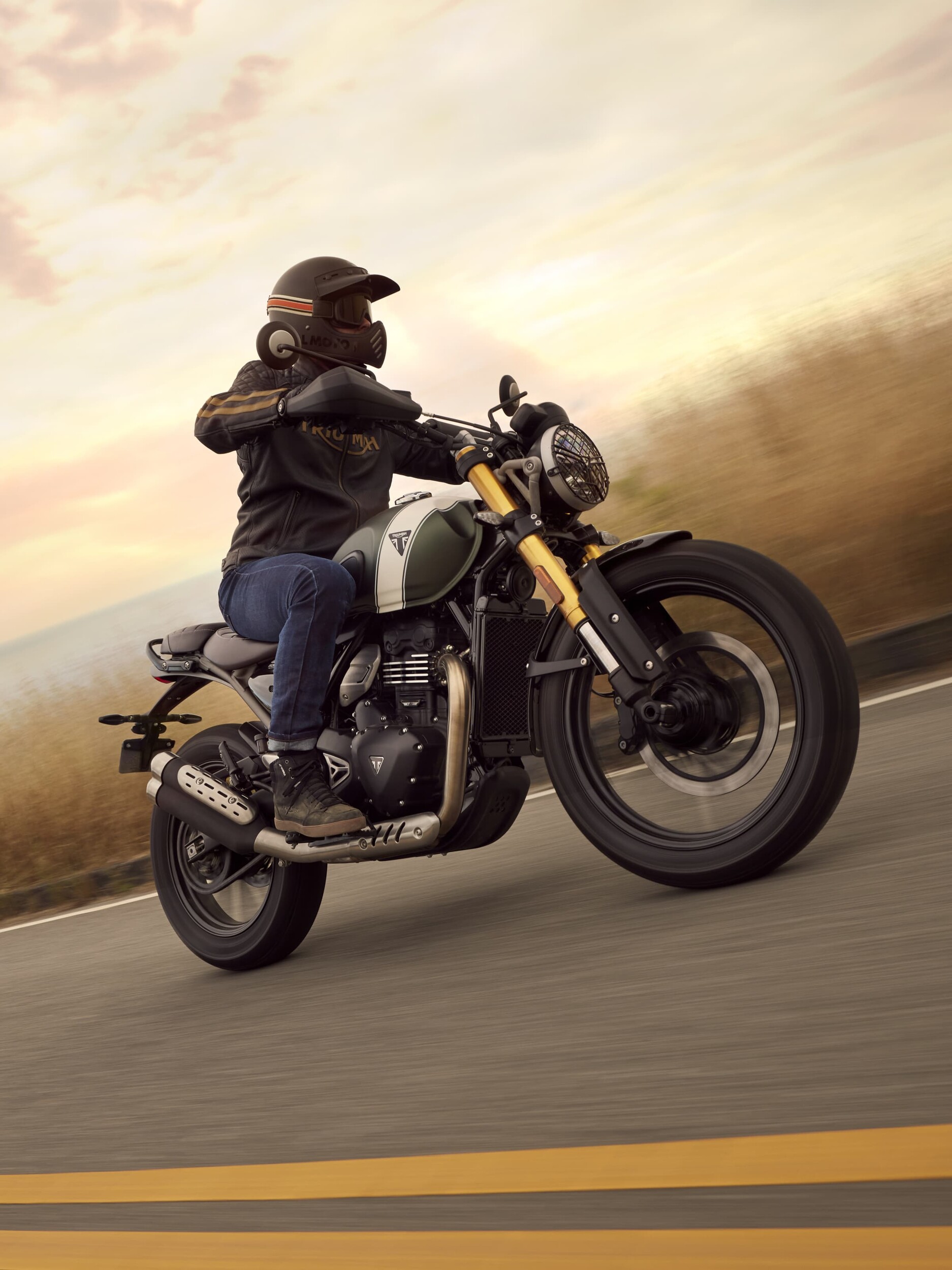 Triumph Scrambler 400 X being ridden on the road