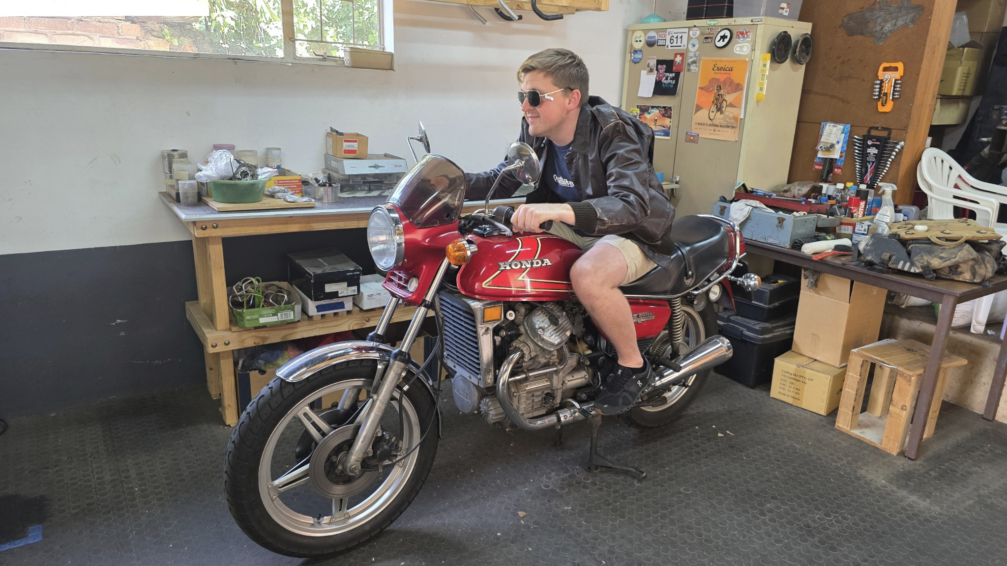 Ben Viljoen leaning over the Honda CX500 controls